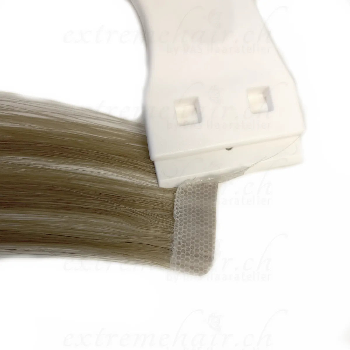 Scraper for tape extensions